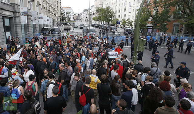 Protestors gather close to Spain's Parliament ahead of a demonstration in Madrid